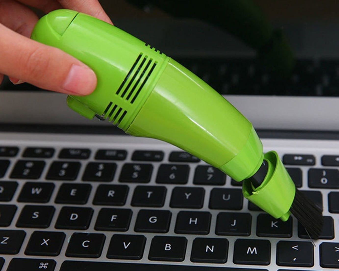Lightweight USB mini vacuum for precise cleaning of small areas and gadgets.