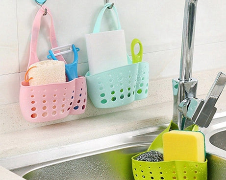 Adjustable plastic basket for kitchen sink, perfect for drainage and organizing small items.