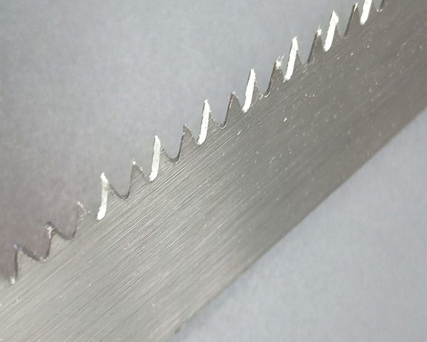 Pruning saw with handle close-up.