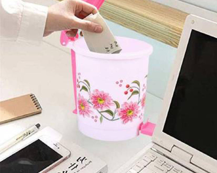 Small plastic pedal dustbin for home or office, easy hands-free use.