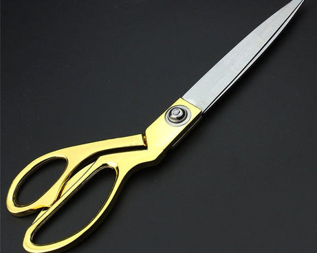 High-end gold-plated scissors for professional use.