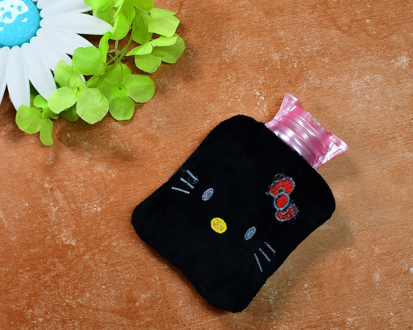 Hot water bag with Hello Kitty design, black color, for warming and pain relief