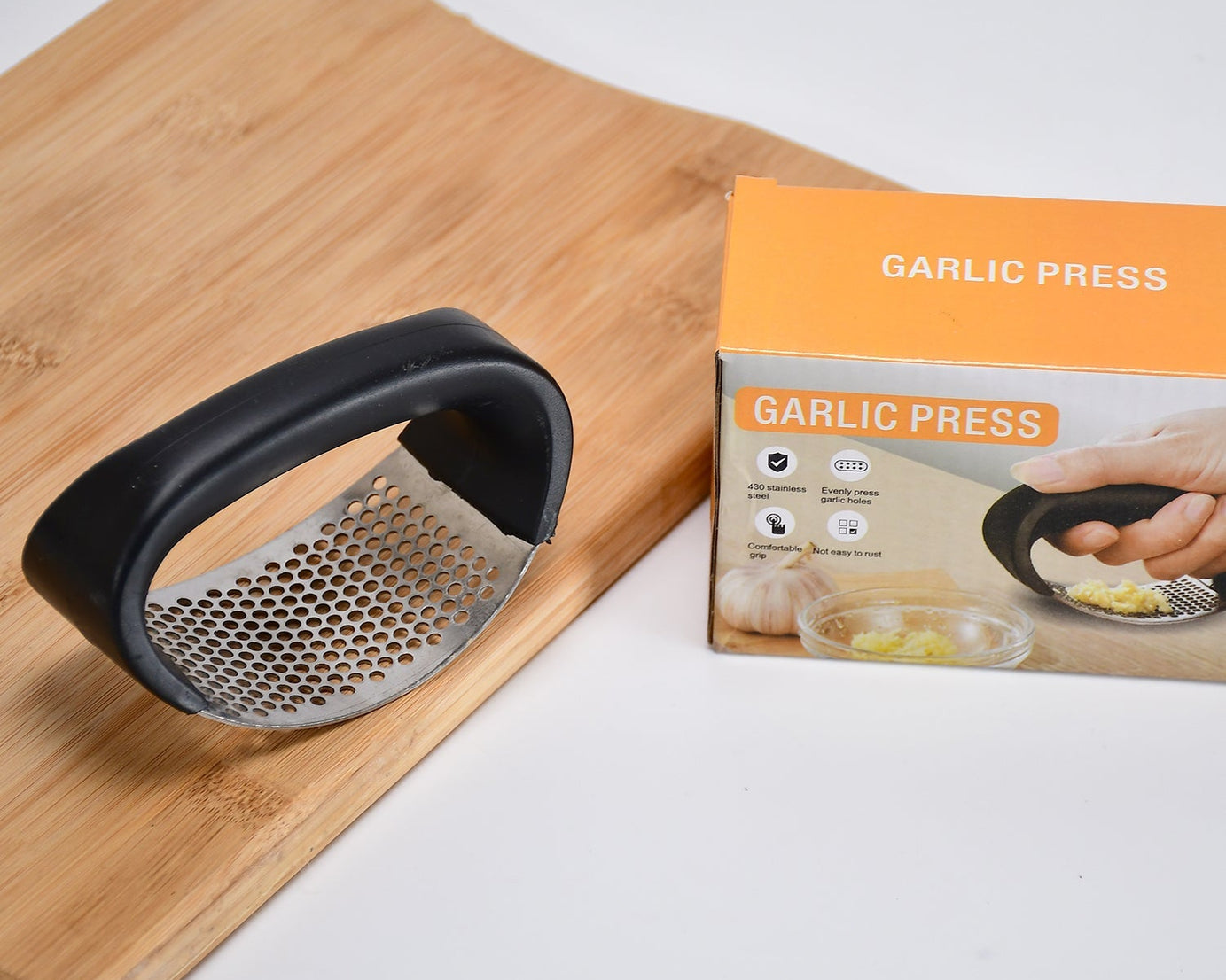 Heavy-duty stainless steel garlic presser for easy crushing.
