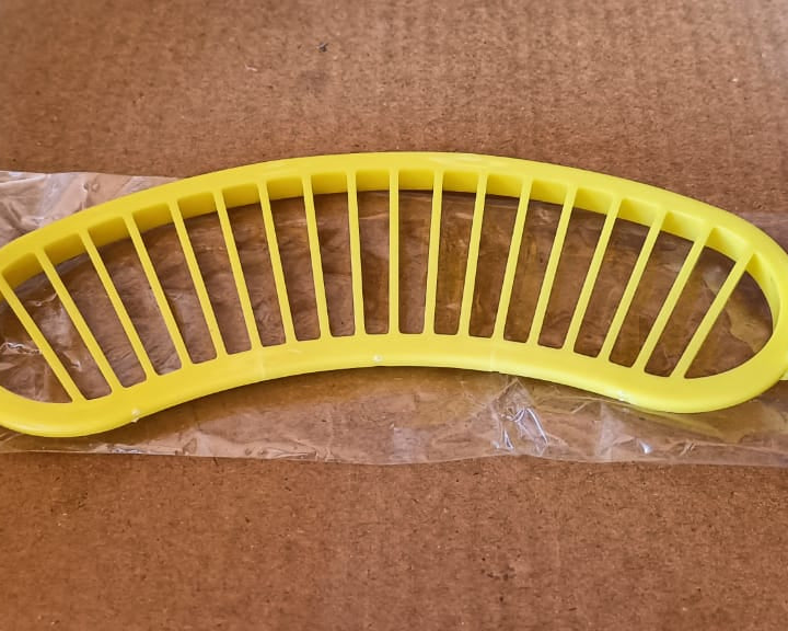 Banana slicer with handle for safe and efficient cutting.
