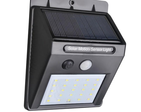 Solar LED light with motion sensor for outdoor use.