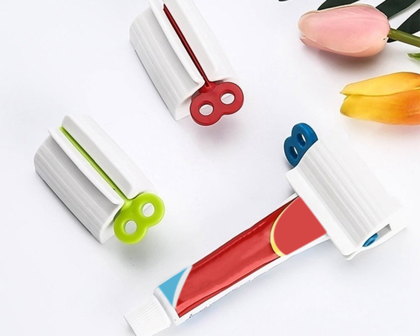 Toothpaste squeezer and holder stand for rolling tubes