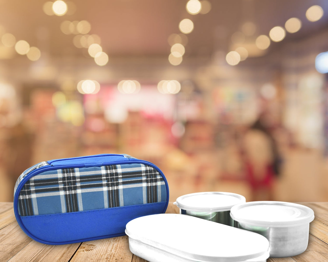 Stacked stainless steel lunch containers for office use