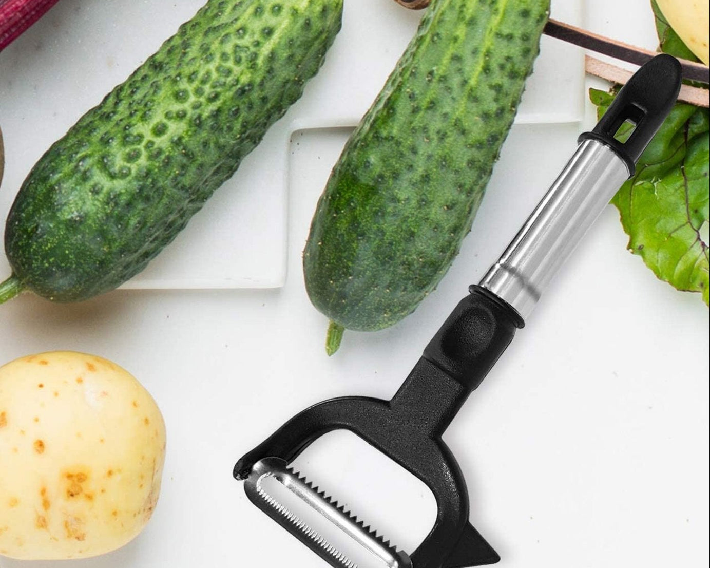 Peeler showing both julienne and blade