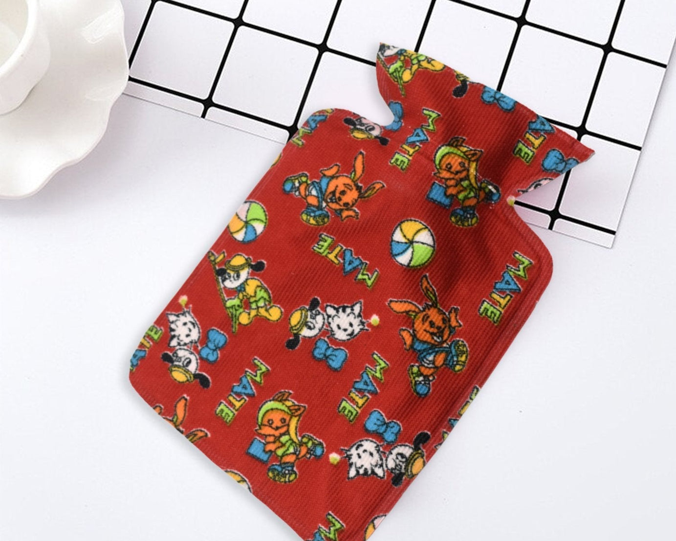 Small rubber hot water heating pad for pain relief.