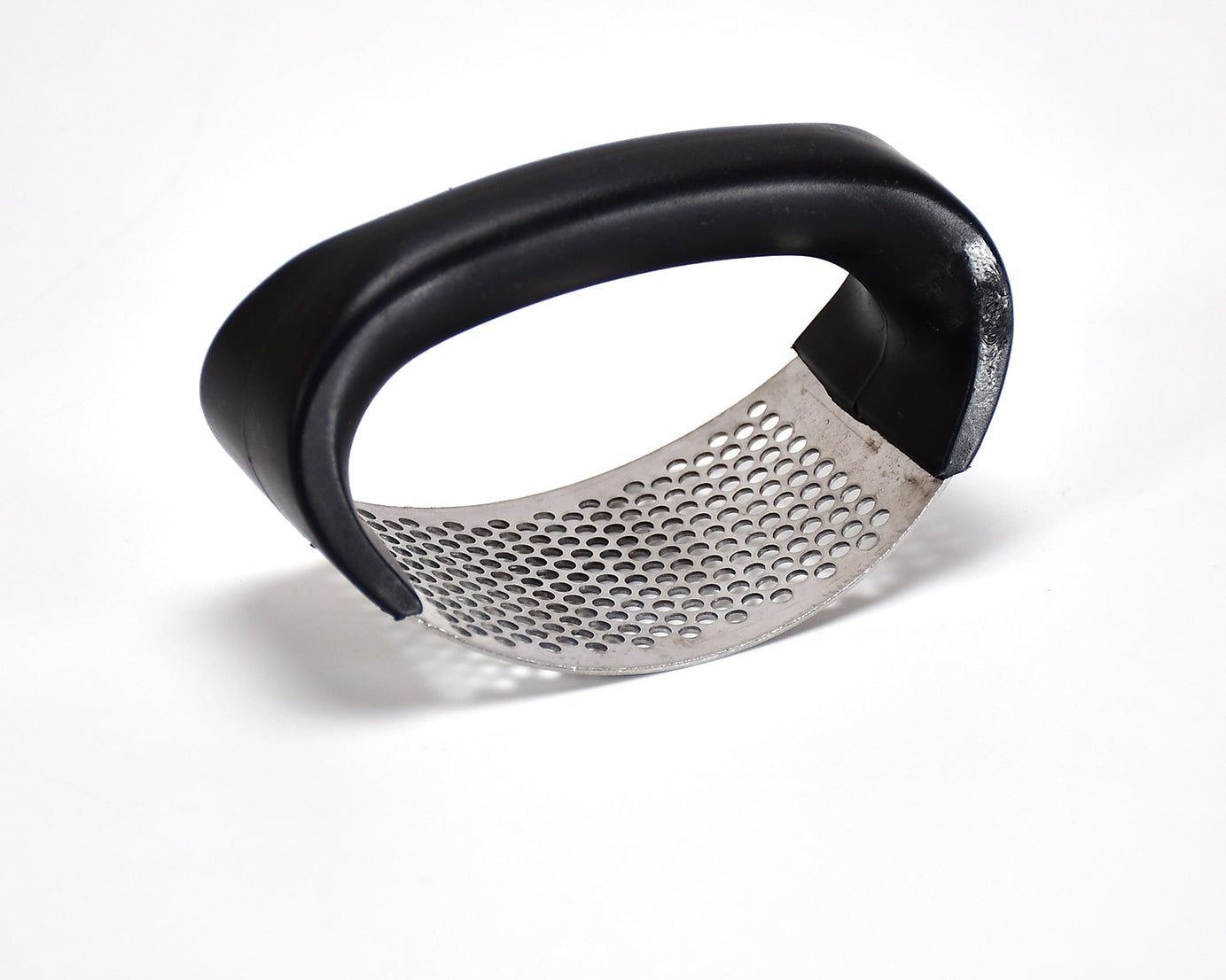 Stainless steel garlic crusher with comfortable grip handle.