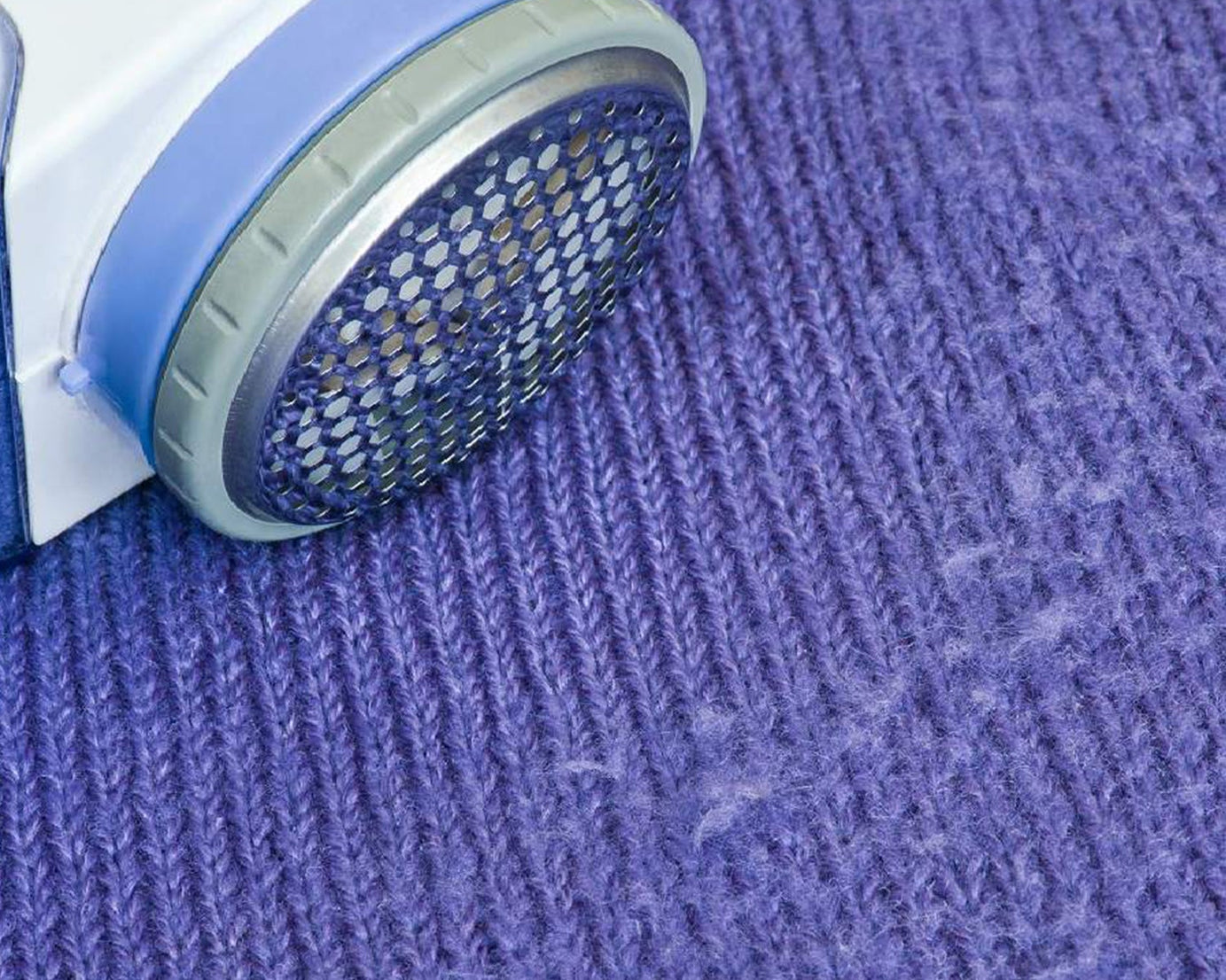 Detailed image of the lint remover, highlighting its design for removing lint from woolens