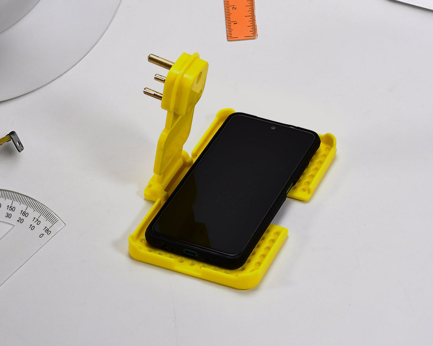 Multi-purpose charging holder for wall socket.