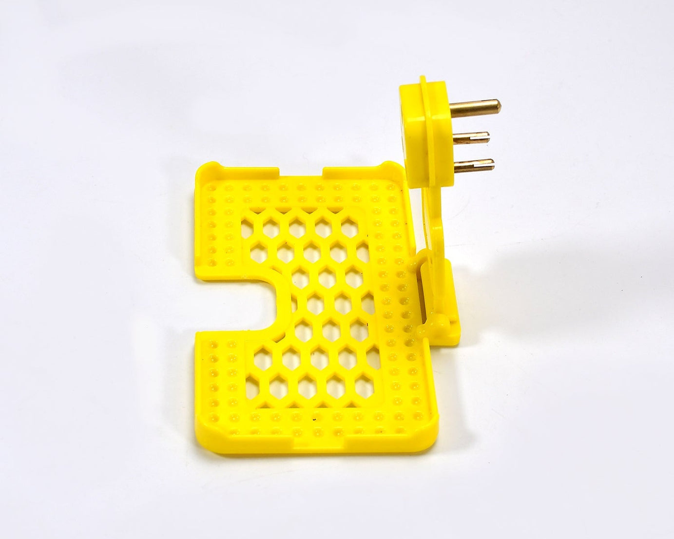 Wall-mounted mobile charging holder in yellow.
