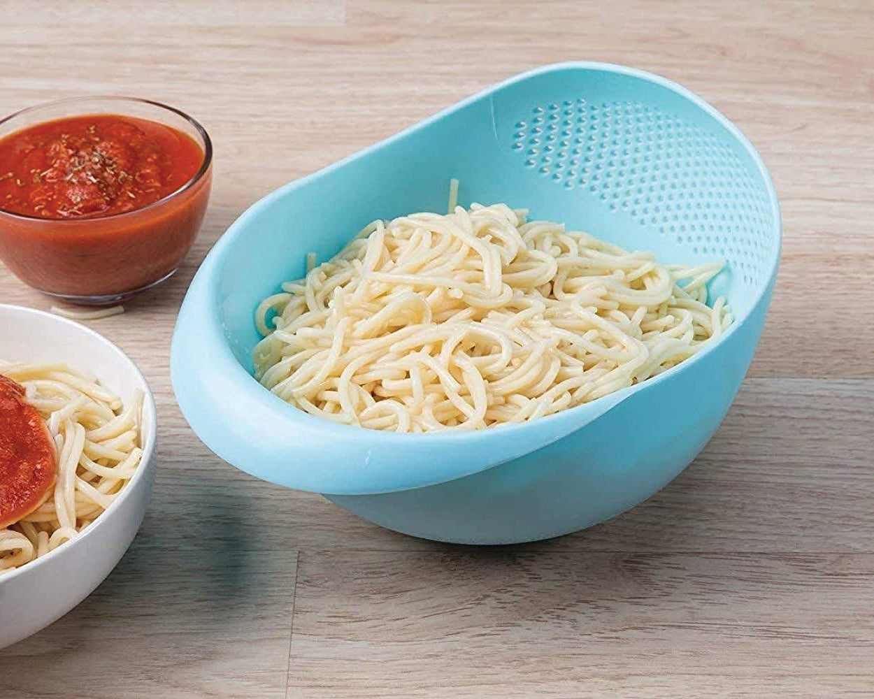 Large plastic rice bowl strainer, ideal for washing and storing grains.