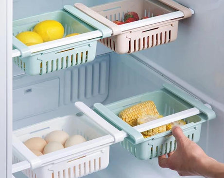Adjustable fridge organizer drawers for storage.