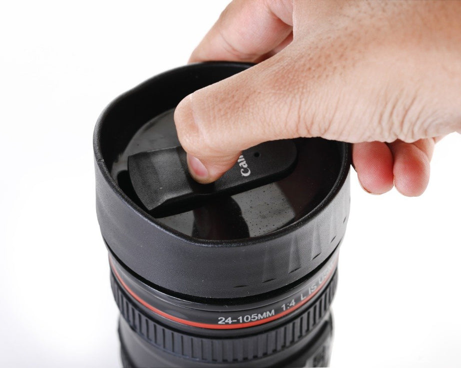 Coffee mug designed as a camera lens, with a secure lid