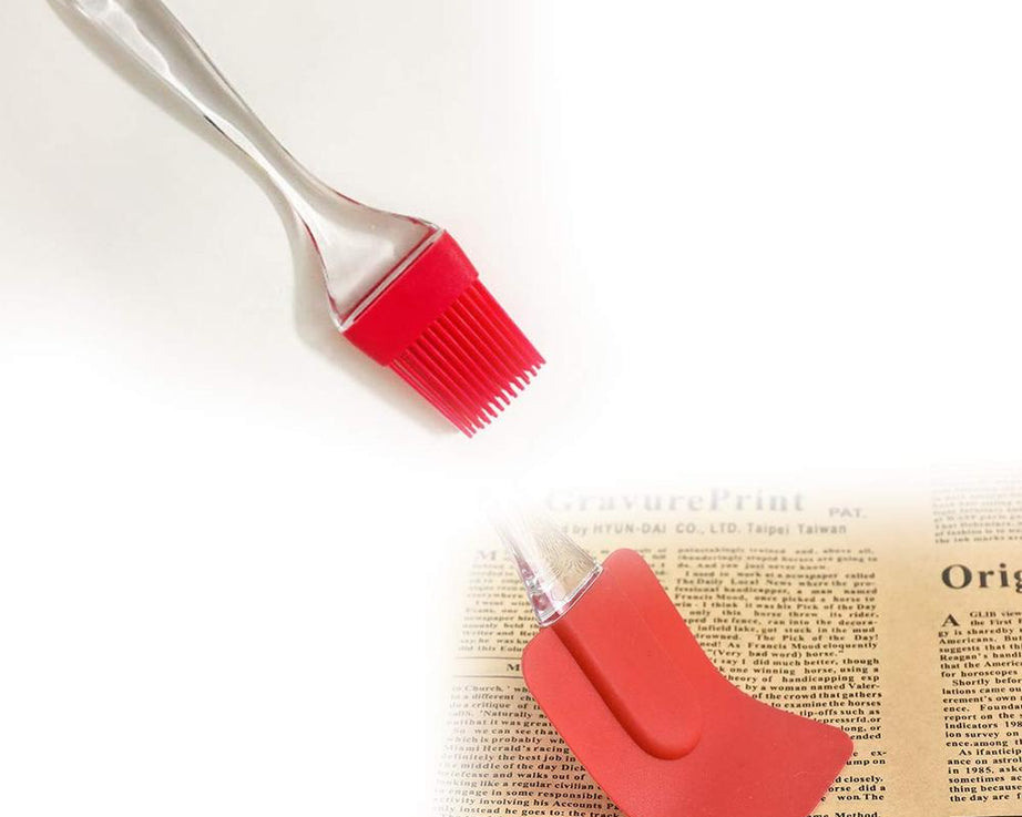 Cake mixer accessories including spatula and brush.