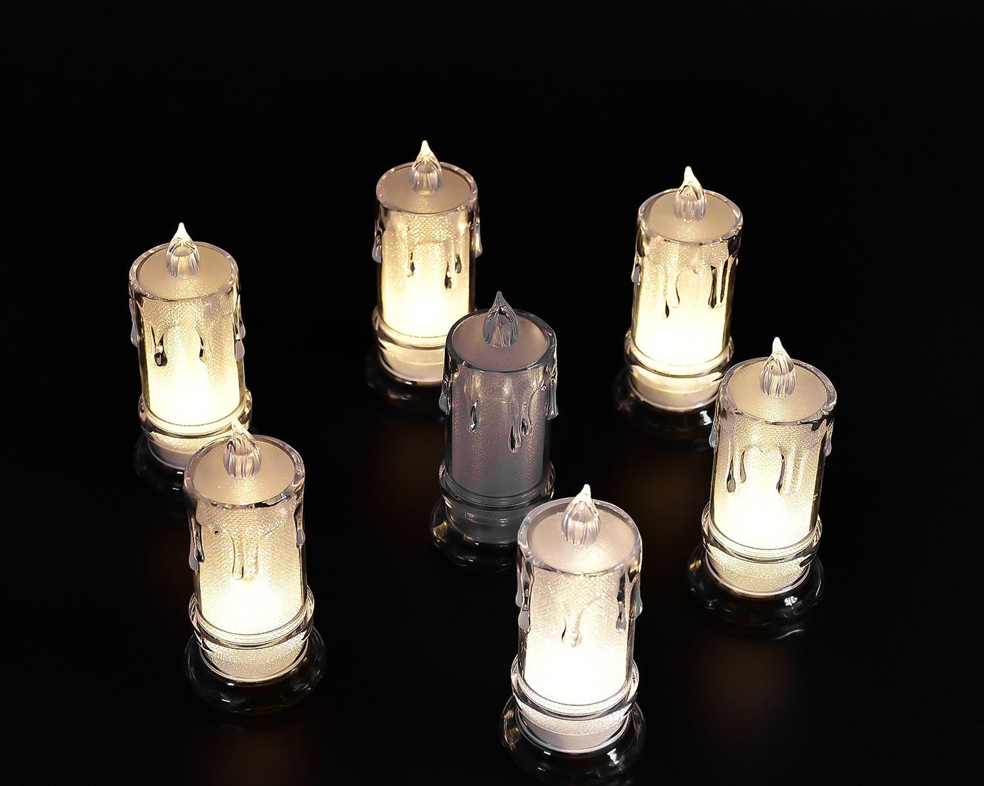 Large flameless candles with a melted design.