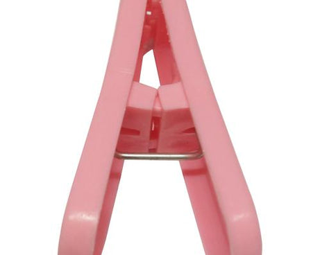 Durable plastic cloth drying clips in vibrant colors.