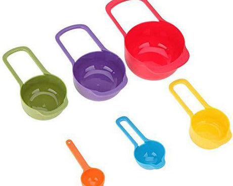 Colorful plastic measuring spoons with measurement marks