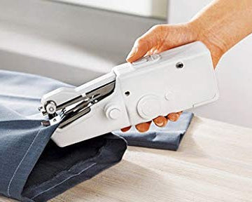Mini sewing machine with fabric and thread