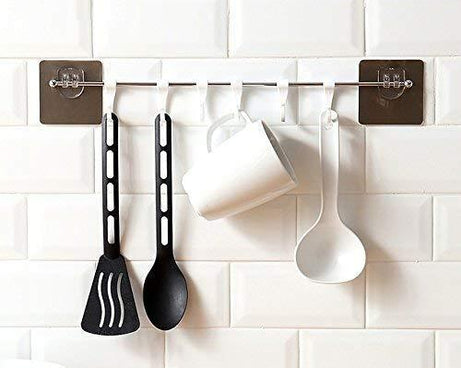 Multipurpose self-adhesive hooks, plastic, suitable for home use.