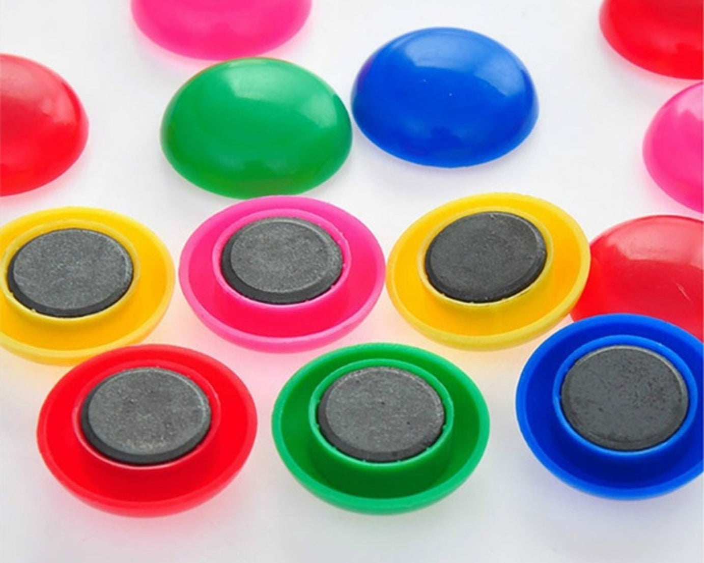 Circular plastic magnets, close-up.