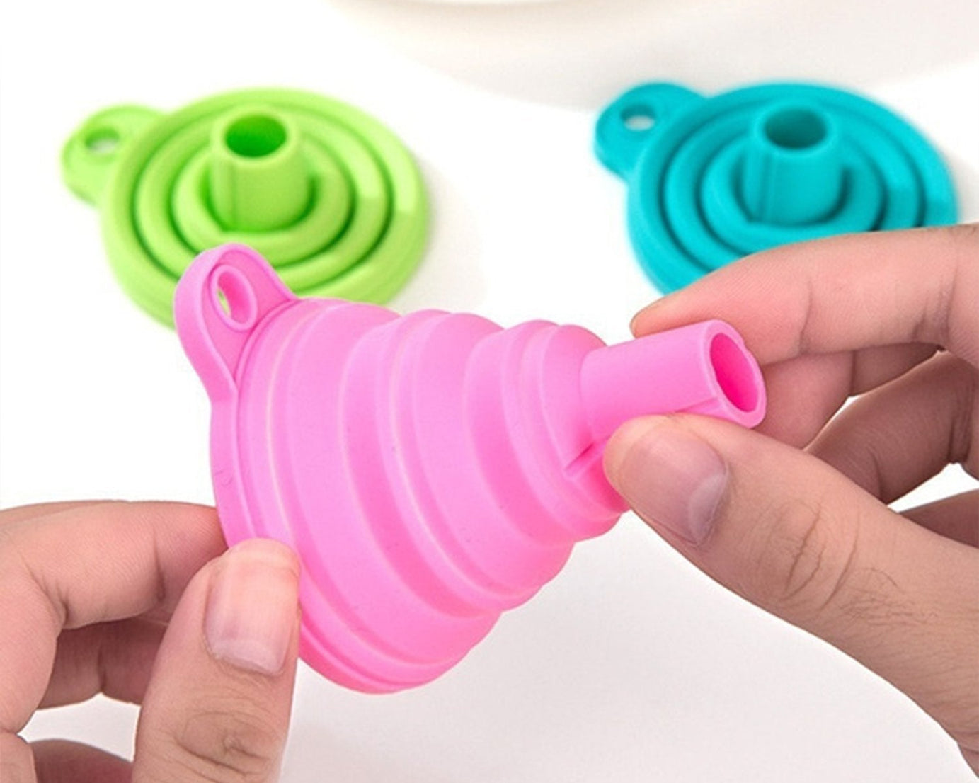 Silicone funnel for pouring liquids.