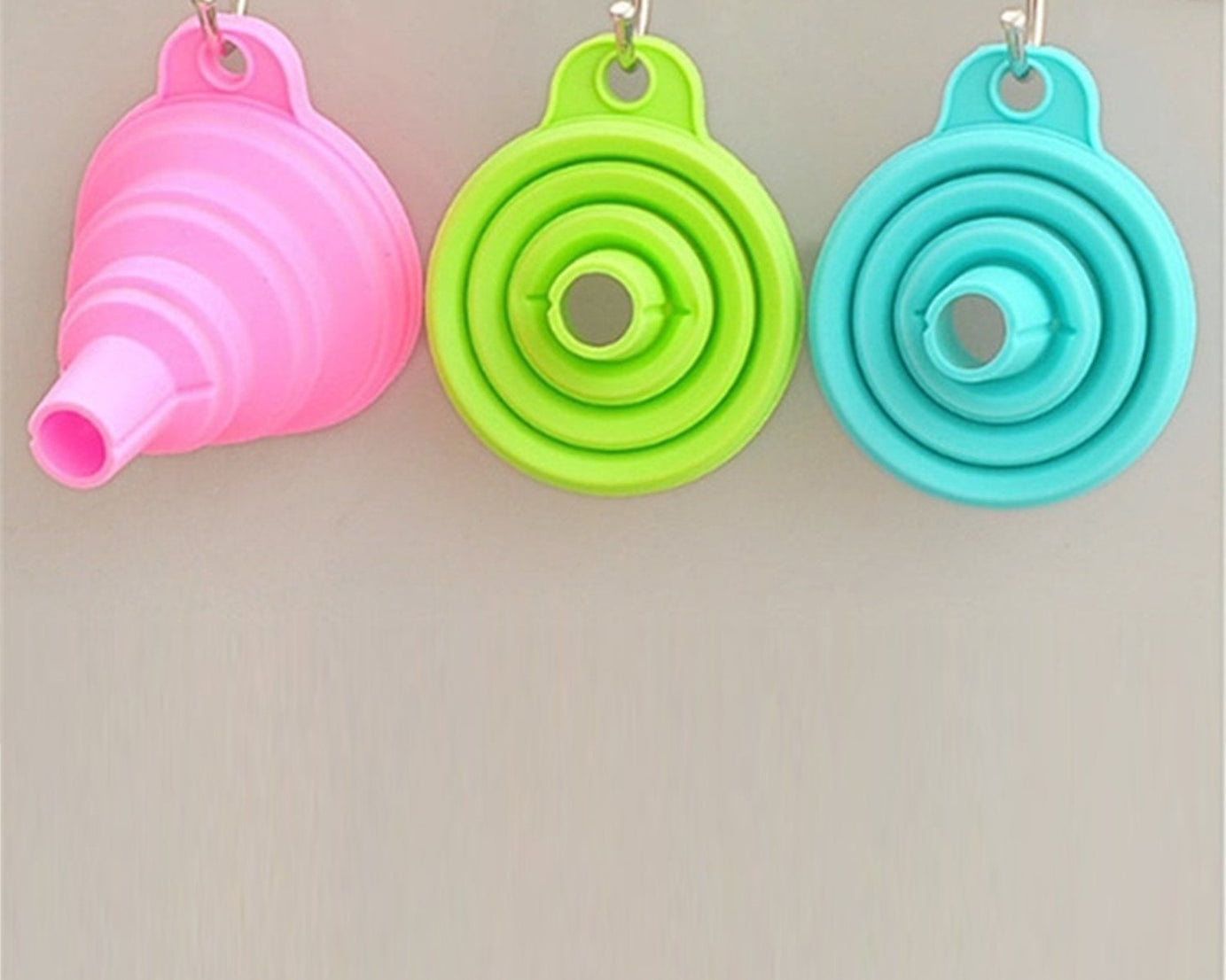 Foldable silicone funnel for kitchen use.
