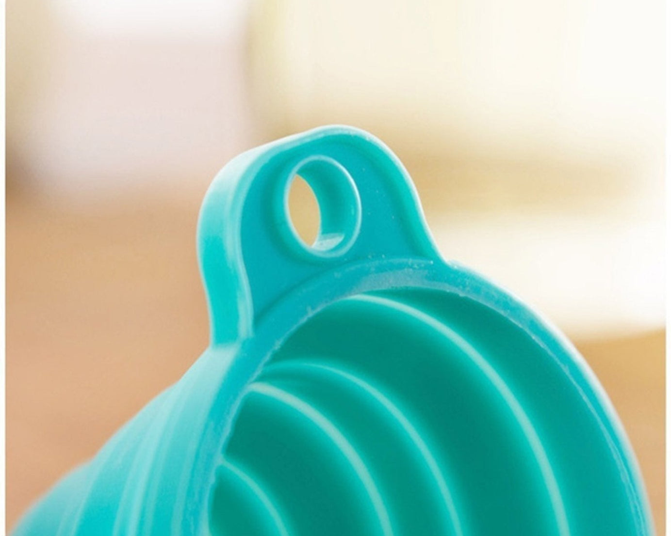 Close-up of silicone funnel for pouring.