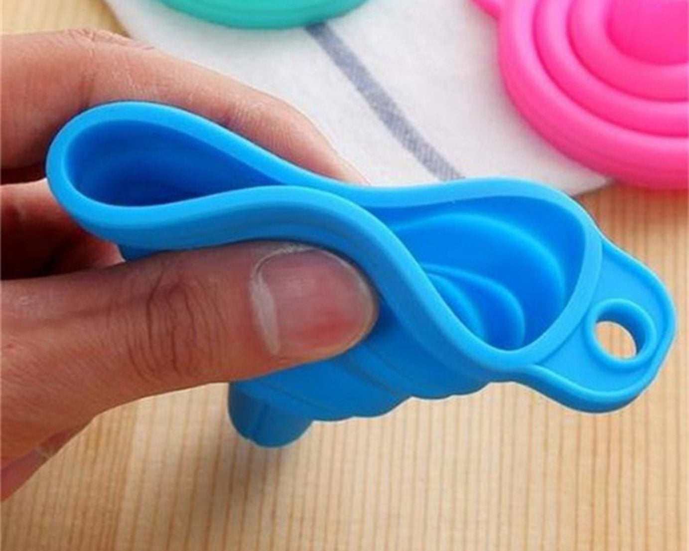 Multi-use silicone funnel for sauces and liquids.