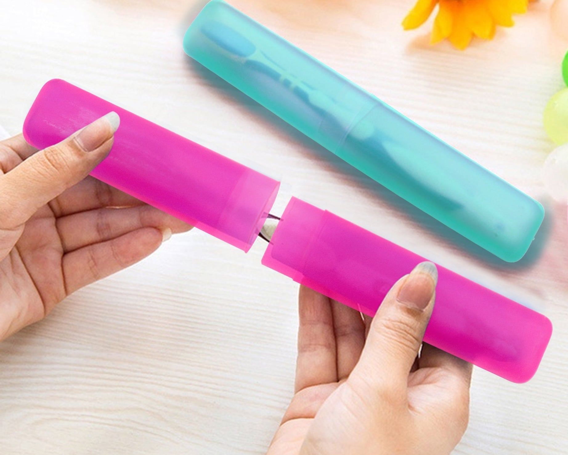 Set of four portable toothbrush cases.