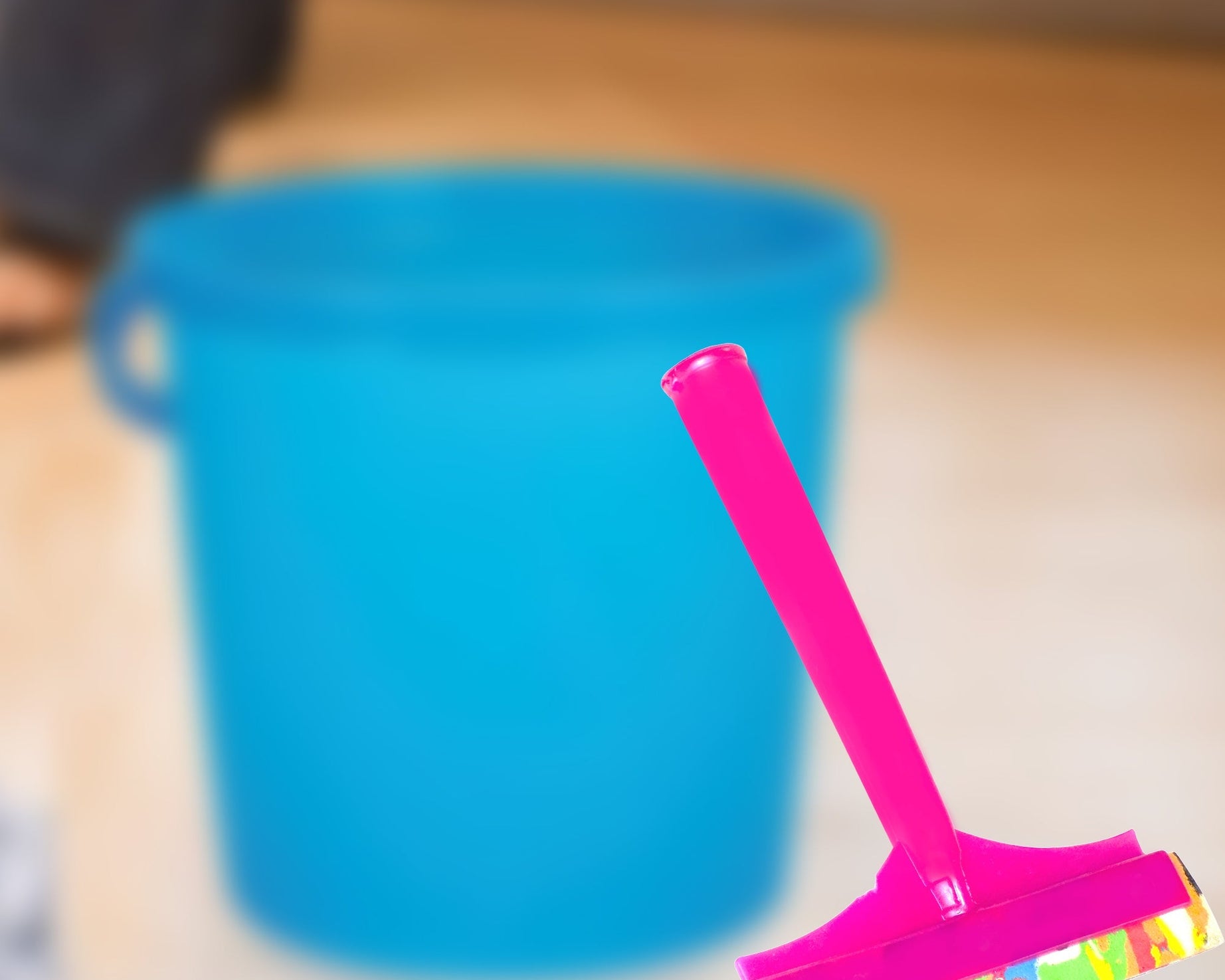 Foam handle bathroom wiper for easy floor cleaning.