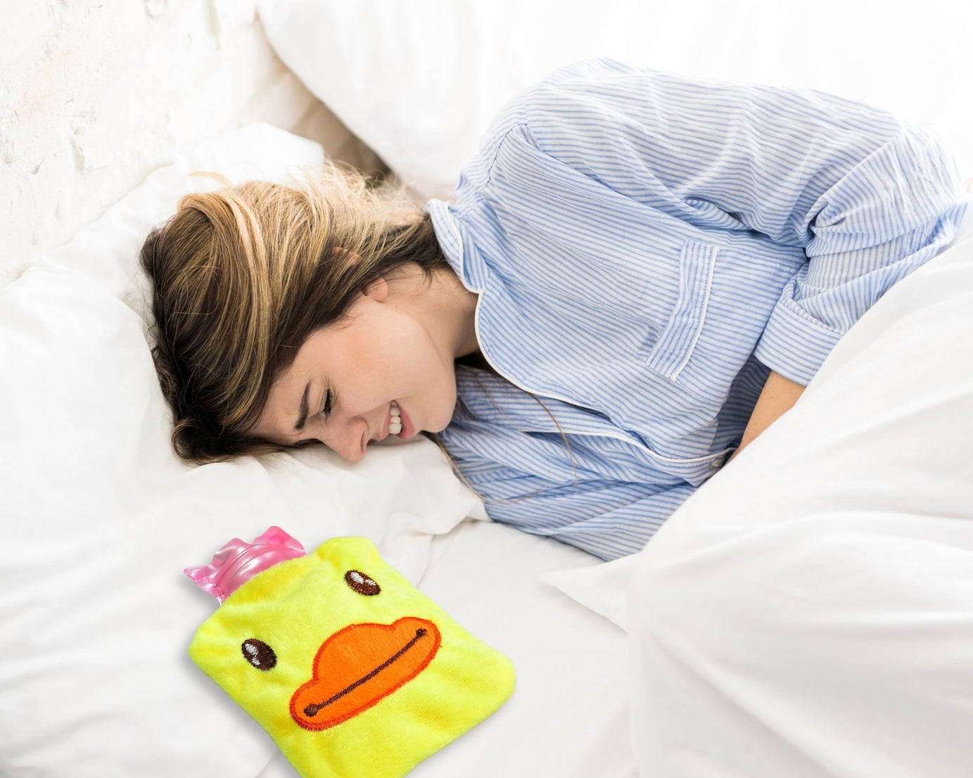 Hot water bag with a cute yellow duck cover for pain relief and warming