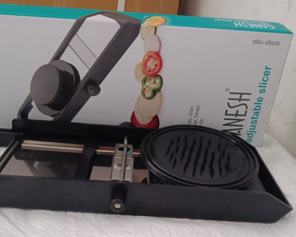 Ganesh adjustable plastic slicer, 1 piece, black and silver color.