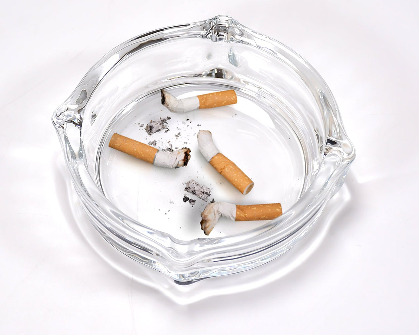 Crystal glass ashtray for cigars and cigarettes.