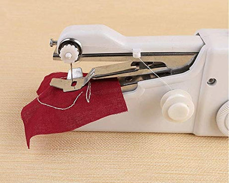 Compact handheld sewing machine with accessories