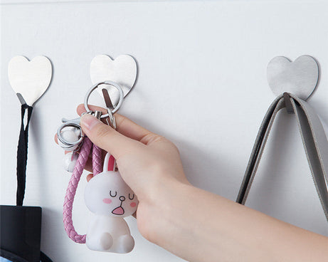 Strong adhesive wall hooks, pack of 3, durable.