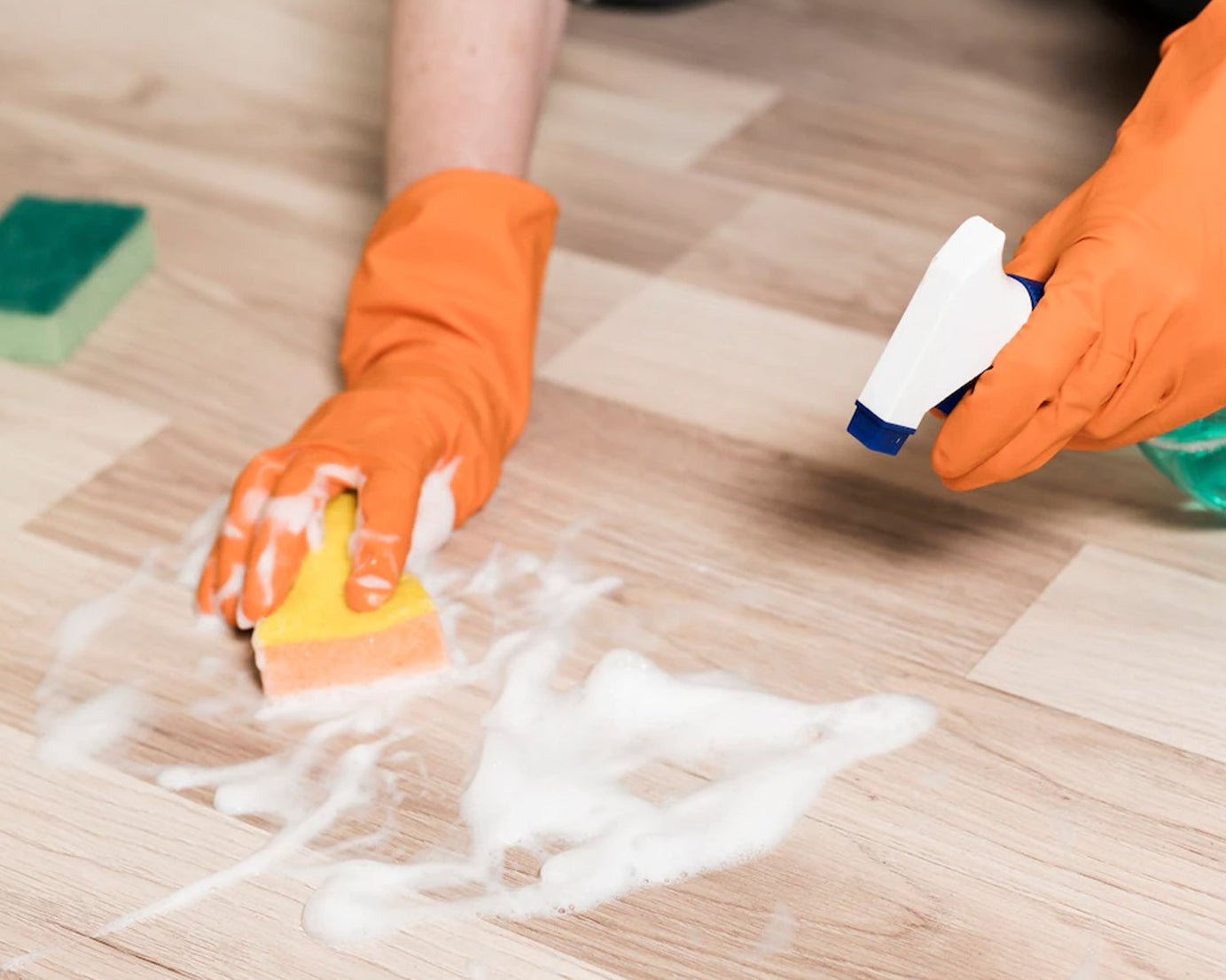 Orange gloves suitable for cleaning tasks