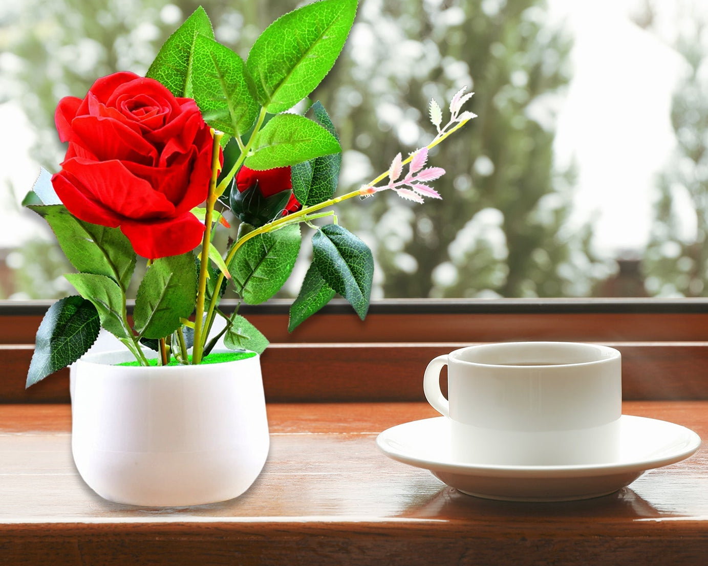 Artificial rose plant in a decorative pot
