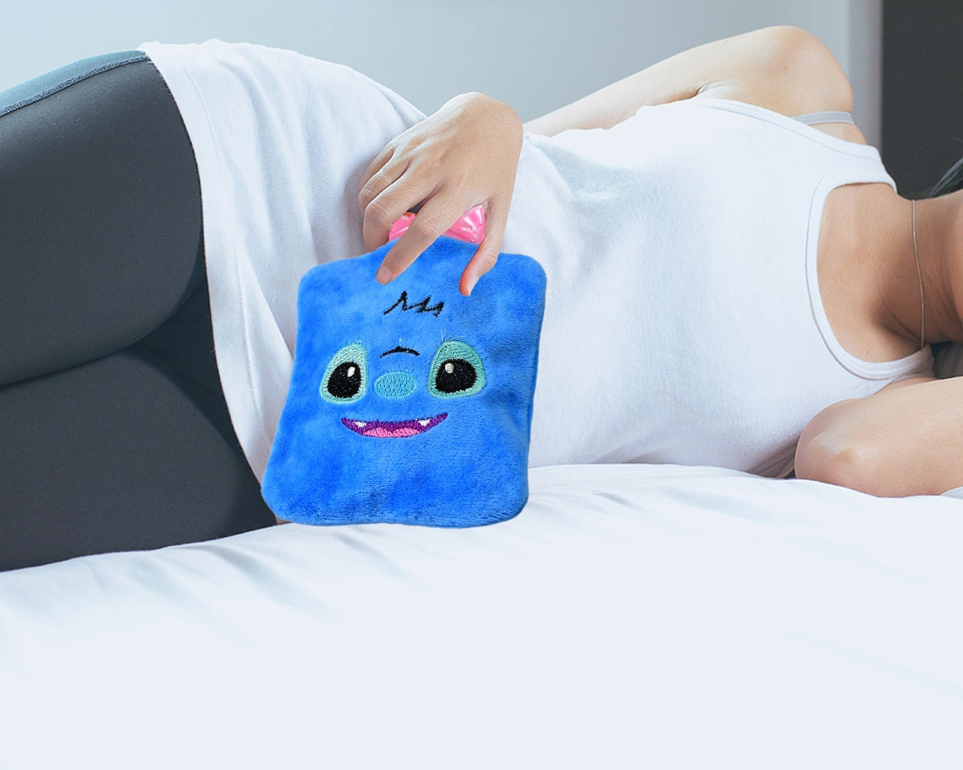 Small blue stitch hot water bag with cover for warming and pain relief