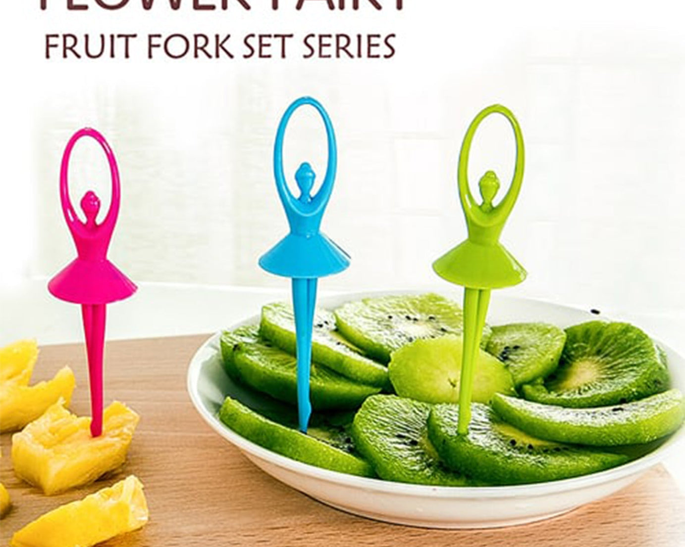 Fruit fork cutlery set with a playful dancing doll stand