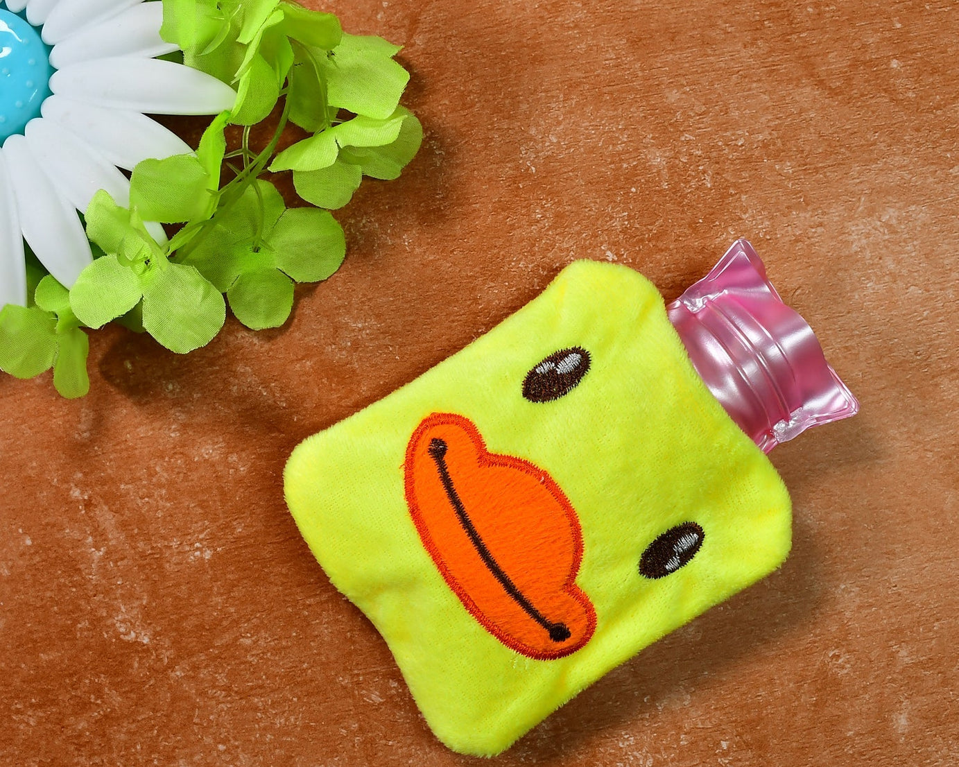 Yellow duck hot water bag with cover for pain relief and warming