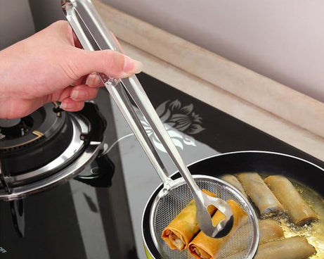 Stainless steel filter spoon with clip for kitchen use.