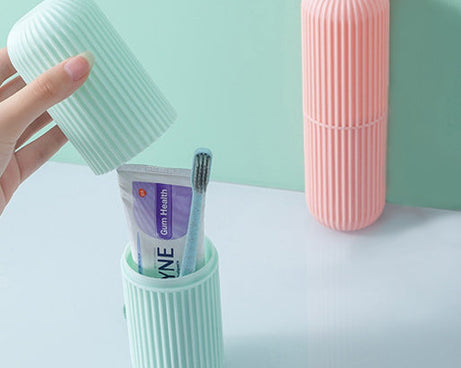 Capsule-shaped organizer for portable storage, available in multiple colors.