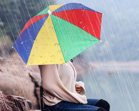 Hands free umbrella hat for sun and rain protection.