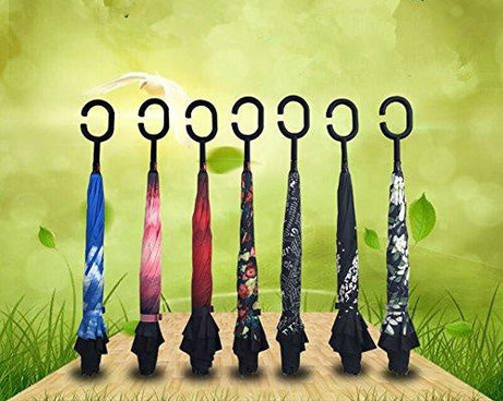 Travel umbrella with reverse mechanism