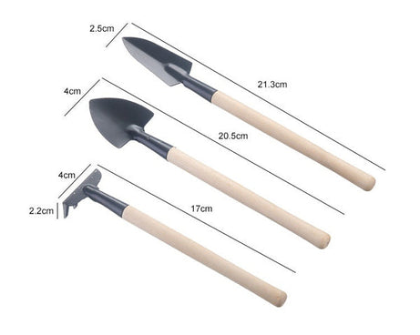 Set of kid's garden tools: trowel, shovel, rake