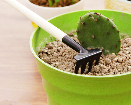 Kid's gardening set with trowel, shovel, and rake