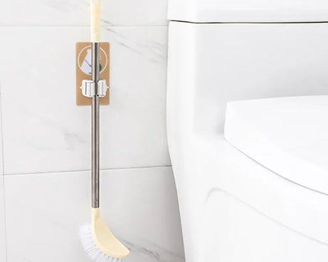 Magic sticker mop and broom holder for keeping cleaning tools organized.